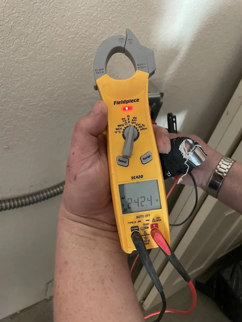 Voltage testing with clamp meter during Outlet Installation in Easton